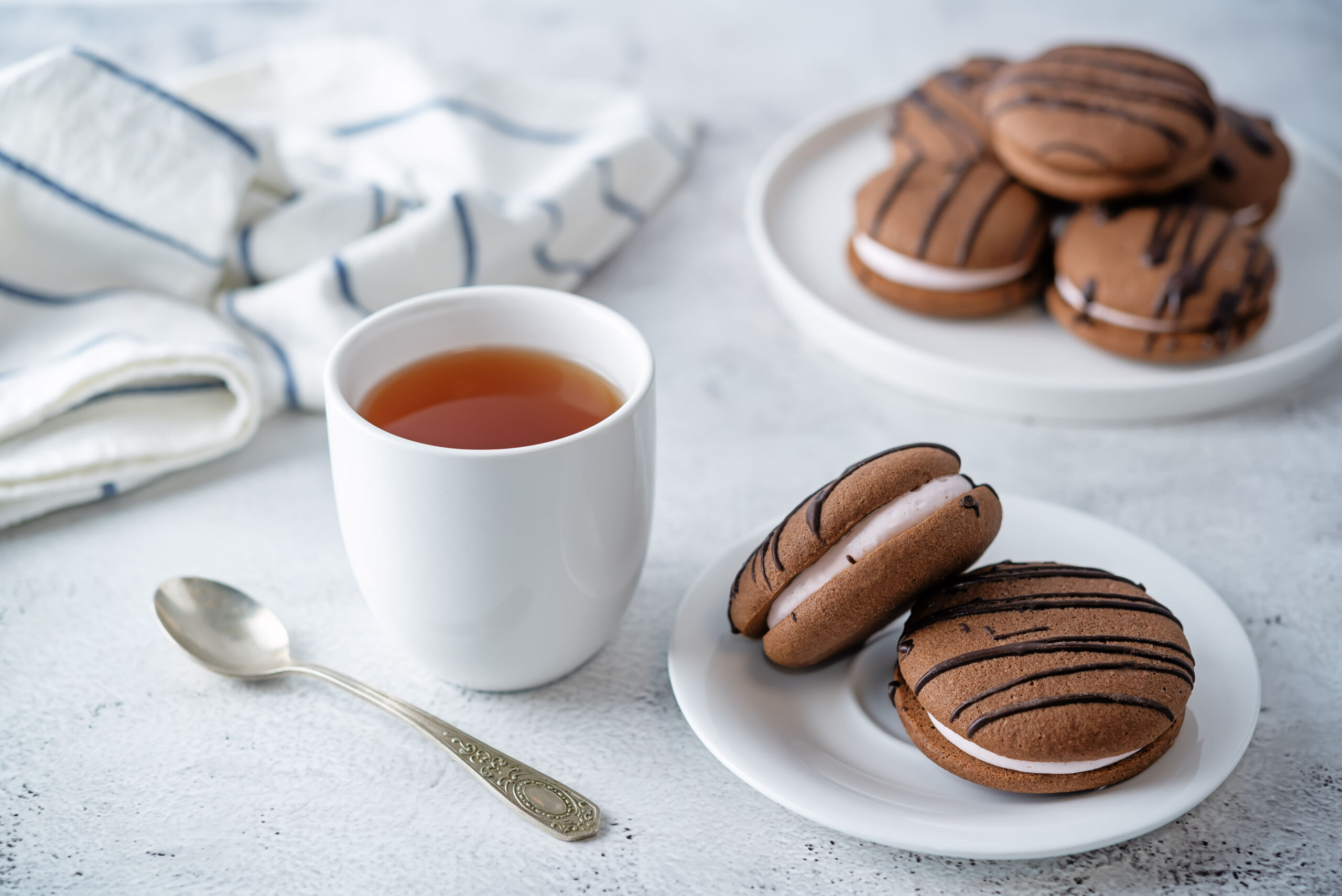 Soft chocolate cookies with marshmallow filling. toning. selective focus
